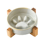 Ceramic Slow Feeder Bowl side view showing stable wood stand
