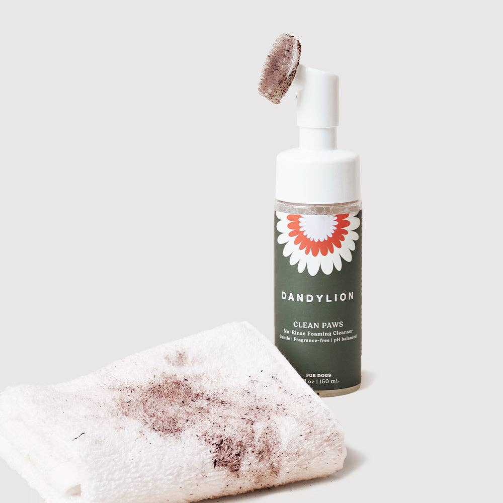 Clean Paws No-Rinse Foaming Cleanser bottle next to a dirty paw towel