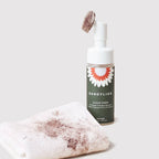 Clean Paws No-Rinse Foaming Cleanser bottle next to a dirty paw towel