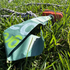 Close-up of a torn-open compostable dog poop bag attached to a rope toy