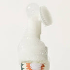 Close-up of the Clean Paws foaming cleanser pump with silicone brush