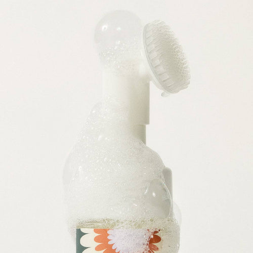 Close-up of the Clean Paws foaming cleanser pump with silicone brush